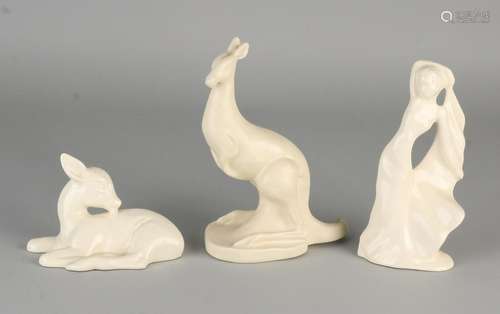 Three cream colored Hollandse ceramics plateel figures.