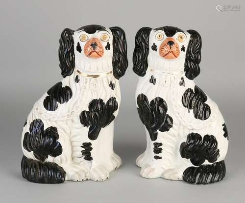 Two antique English Staffordshire ceramic dogs.