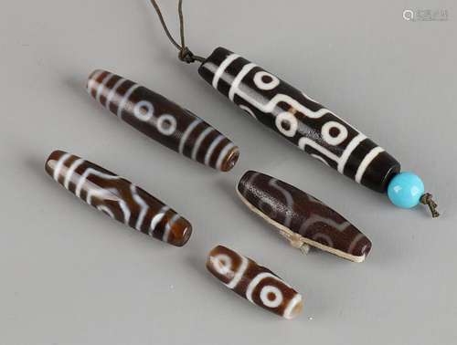 Five ancient Tibetan (horns?) Beads. 20th century.