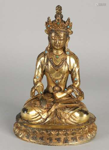 Chinese gilt bronze Buddha sitting on lotus. With