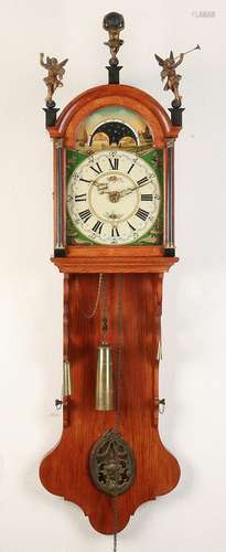 Oak Frisian clock with moon phase, date and alarm.