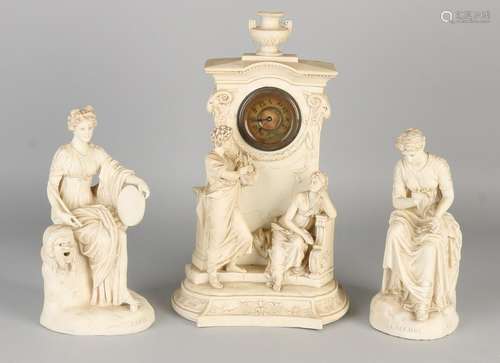 Bisquit porcelain antique clocks couple. Circa 1900.