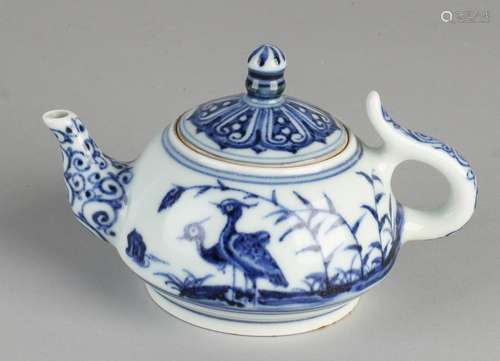 Ancient Chinese porcelain teapot with bird décor and