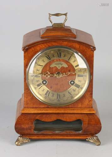 Carrot Walnut Warmink table clock with bronze legs.