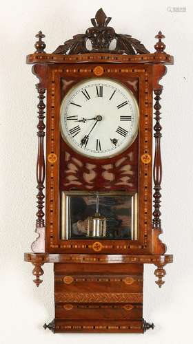 American antique wall clock with intarsia. Circa 1910.