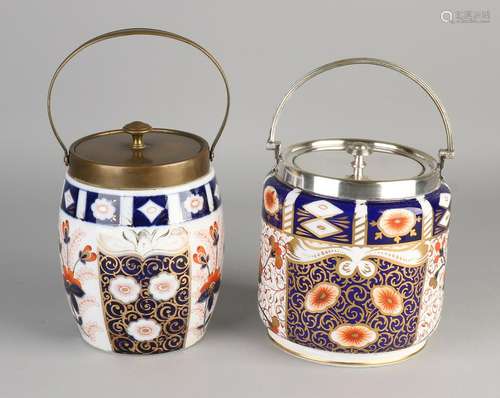 Two antique porcelain biscuit tins with Imari decor.