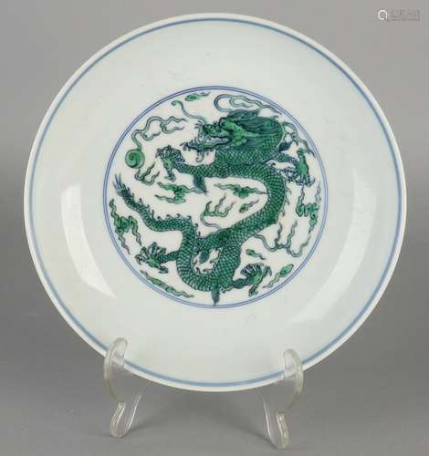 Chinese porcelain plate with dragon decor. Bottom