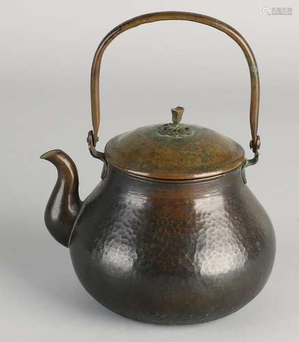 Chinese antique copper teapot beaten with rosette.