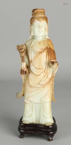 Chinese jade Buddha with mace on wooden console. 20th