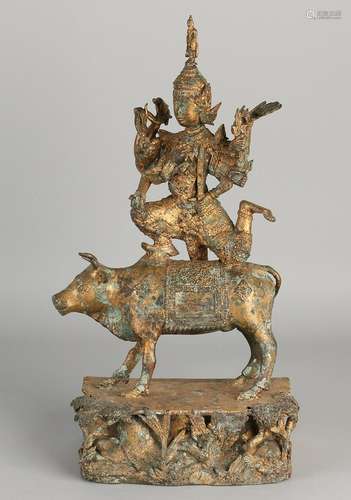 Oriental bronze Buddha figure on sacred bull. 20th