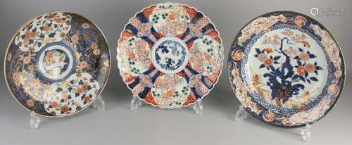 Three large 19th century Imari porcelain dishes. One