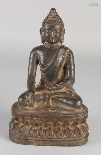 Chinese iron Buddha in lotus position. Size: 21 x 13 x