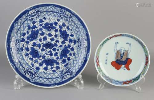 Two Chinese porcelain plates. One sign of monks, six