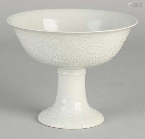 Chinese Blanc de Chine cup on high foot. Embossed