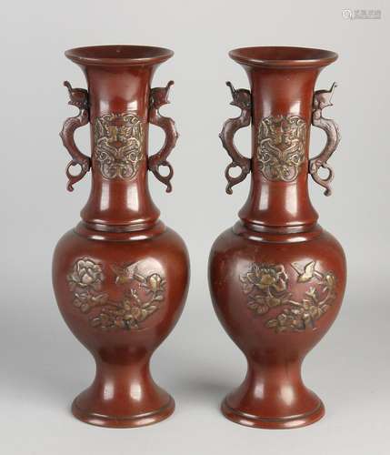 Two antique Japanese bronze vases with dragons / flower