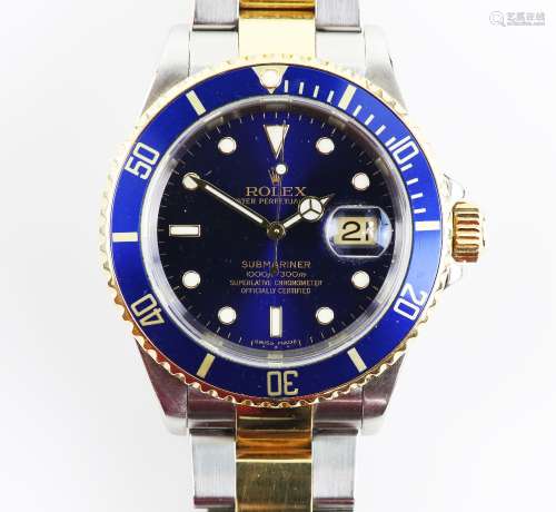 A Rolex Submariner gentleman’s automatic wristwatch, stainless steel case, the rotating blue ceramic