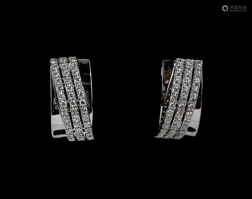 Diamond white gold earrings; each set with thirty-nine round cut diamonds set into three