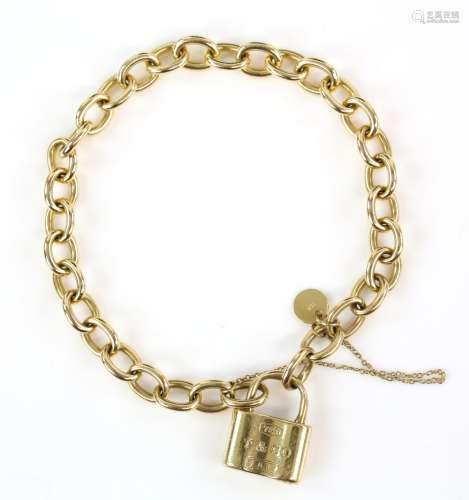 Tiffany & Co gold padlock bracelet, belcher links, in 18 ct yellow gold with safety chain.