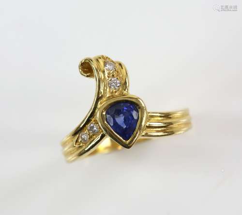 Pear cut sapphire ring accented with four diamonds, 18 ct yellow gold shank, ring size N.