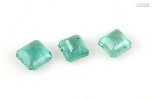 Three loose rectangular step cut emeralds, estimated weights 2.24 carats, 2.11 carats and 1.87