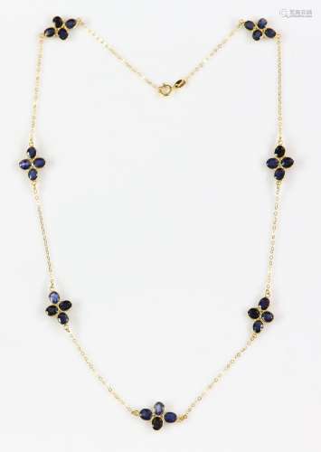 Sapphire cluster necklace; seven clusters of four oval faceted sapphires in floral formation