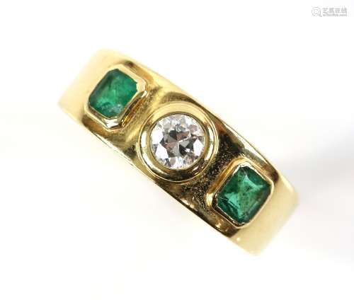 Emerald and diamond three stone ring, centrally set with transitional cut diamond, estimated total