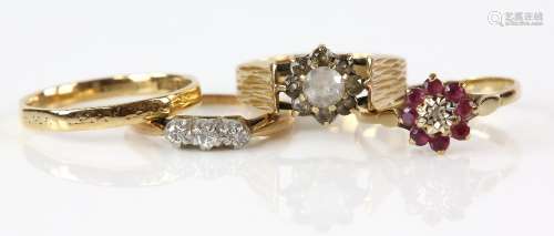 Four gold rings, Swiss cut diamond three stone rings, mounted in platinum and 9 ct, ring size K,