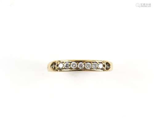 Diamond half eternity ring, set with brilliant cut stones, and diamond set shoulders in heart form