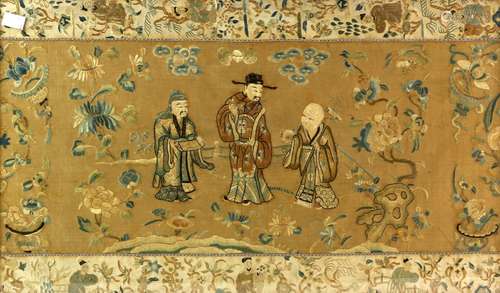 A rectangular Chinese textile decorated with three central figures of The Sanxing, overall