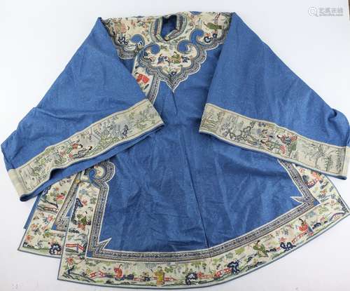 A Chinese blue-ground textile tunic with white ground collar and cuffs; from collar to hem about