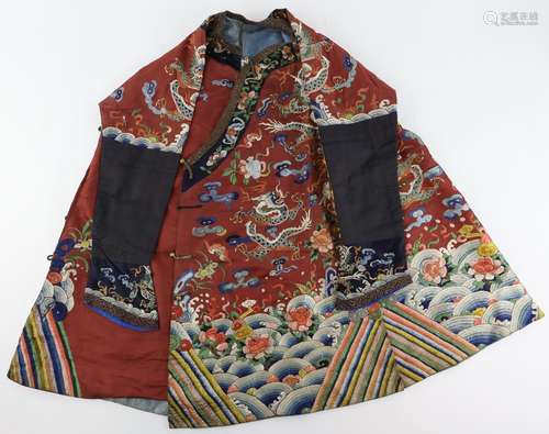 A red-brown ground, Chinese textile tunic, decorated with a variety of symbols and flowers,