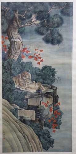 Two Chinese pictures, both framed and glazed: one of tigers beside pine; and one of lions beside