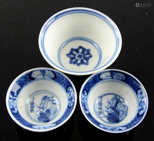 Three small blue and white cups, comprising: two with six-character Wanli marks in underglaze