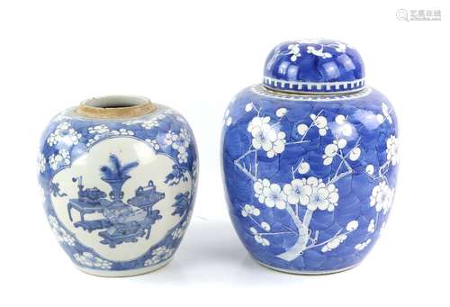 A blue and white prunus decorated jar and domed cover; the base with Kangxi six-character mark,