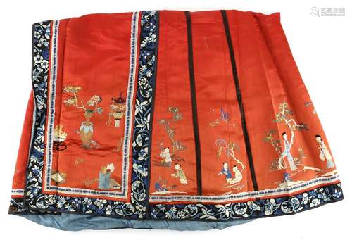 A Tomato-Red ground Chinese textile skirt, decorated with designs of boys and scholar's