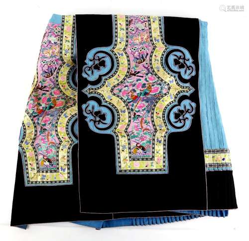 A Chinese textile black-ground skirt, decorated with natural history designs on pink-ground