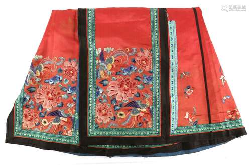 A Tomato-Red ground, Chinese textile skirt; decorated with floral and Natural History designs.