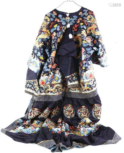 An elegant Chinese blue-ground, textile robe, decorated on the front with a bold design of a