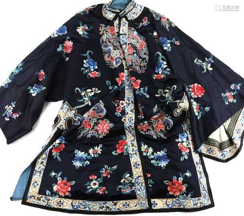 A Chinese silk lady's robe with a design of vessels flowers and insects, panels finely embroidered