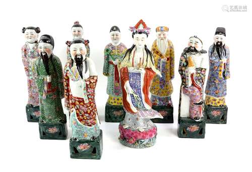 Nine Associated, famille rose or other porcelain, figures; all very approximately 36 cm high; post