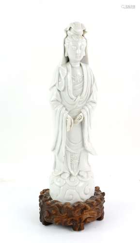 A Blanc-de-Chine standing figure of Guanyin, The Bodhisattva of Mercy, wearing a typical high