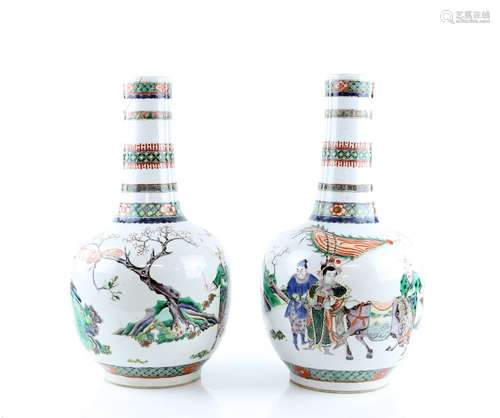 An elegant pair of famille verte vases; each one with oviform body and cylindrical neck, decorated