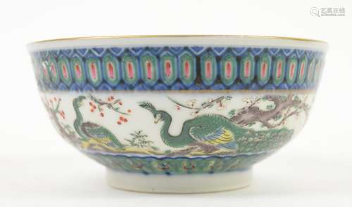 A famille rose bowl, decorated on the exterior with two long-tailed birds beside a large prunus