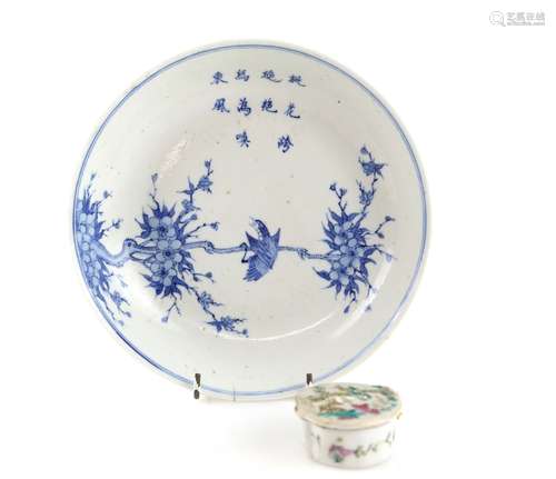 A Chinese blue and white dish, decorated with a bird on plum blossom beneath a three-line poem,