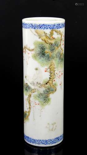 A polychrome porcelain bitong of cylindrical form; decorated with a pair of birds perched in a tree;