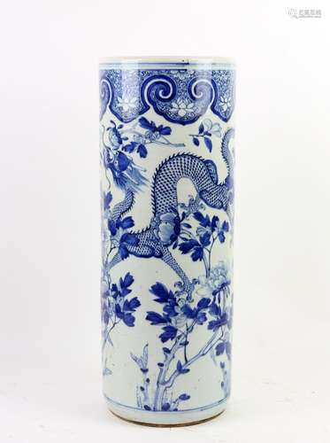 A blue and white stick stand of typical cylindrical form, decorated with bold designs of confronting