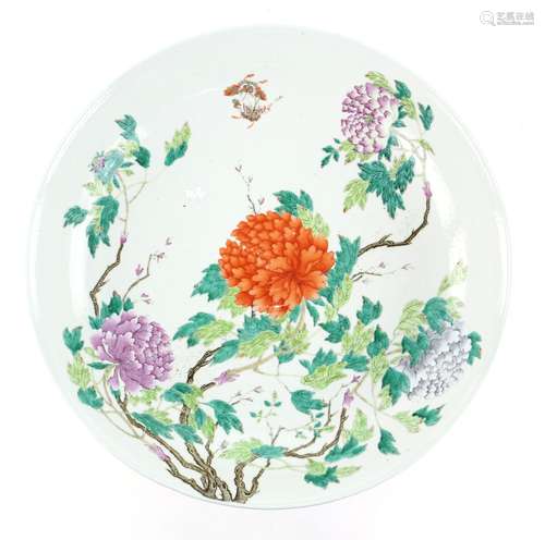 A large and decorative dish of cylindrical form, decorated with butterflies and bold floral designs;