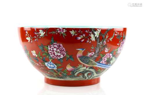 A large famille rose bowl with turquoise interior, decorated on the exterior with birds and