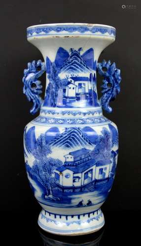 A small blue and white vase and cover with knop finial, decorated with fan-tailed goldfish; the base