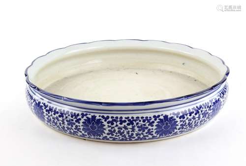 A large blue and white bulb or other bowl with unglazed base; decorated on the exterior with